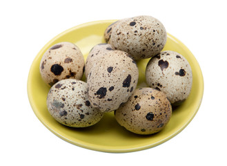 Obraz premium Quail egg in a yellow plate