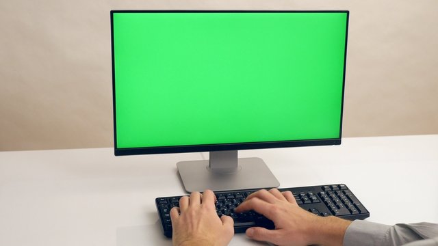 Hands typing keyboard. Green screen PC. Ultra HD, 4K