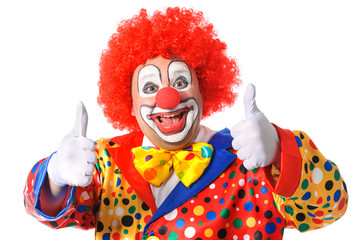Portrait of a smiling clown giving thumbs up isolated on white