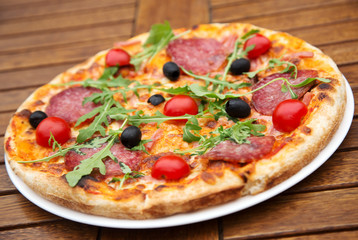 Delicious italian pizza served on wooden table