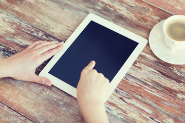 female pointing finger to tablet pc screen