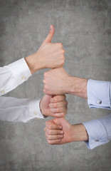 Hands showing thumb up