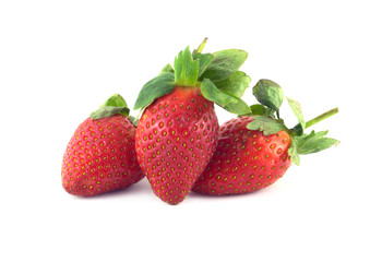 Three strawberry fruits isolated on white closeup