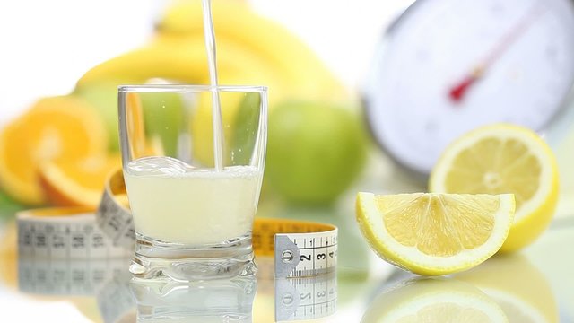 lemon juice poured in glass, fruit meter scale diet food