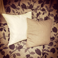 Cushions decorating a sofa with floral design