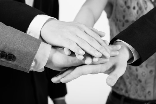 Business group with hands together - teamwork concepts