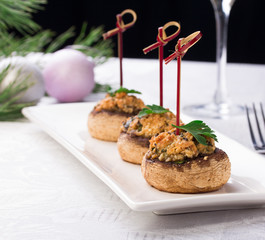 Plate with stuffed mushroom caps.