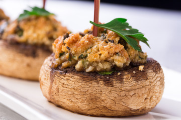 Plate with stuffed mushroom caps.