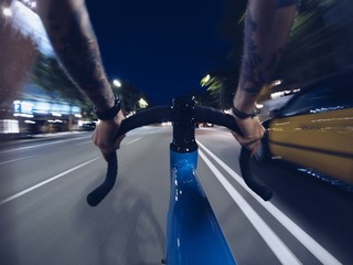 Fast biking on roads of night city