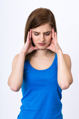 Woman with headache holding her hand to the head