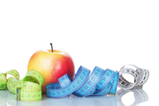healthy diet concept , apple and a measuring
