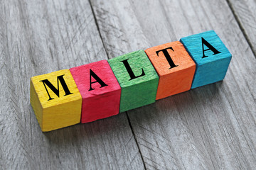word malta on colorful wooden cubes
