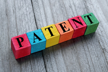 word patent on colorful wooden cubes