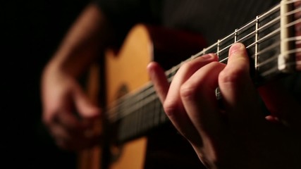 Man playing acoustic guitar - Powered by Adobe