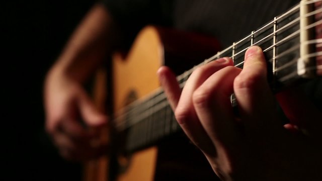 Man playing acoustic guitar