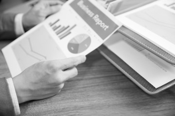Businessman analyzing investment charts with laptop. Accounting
