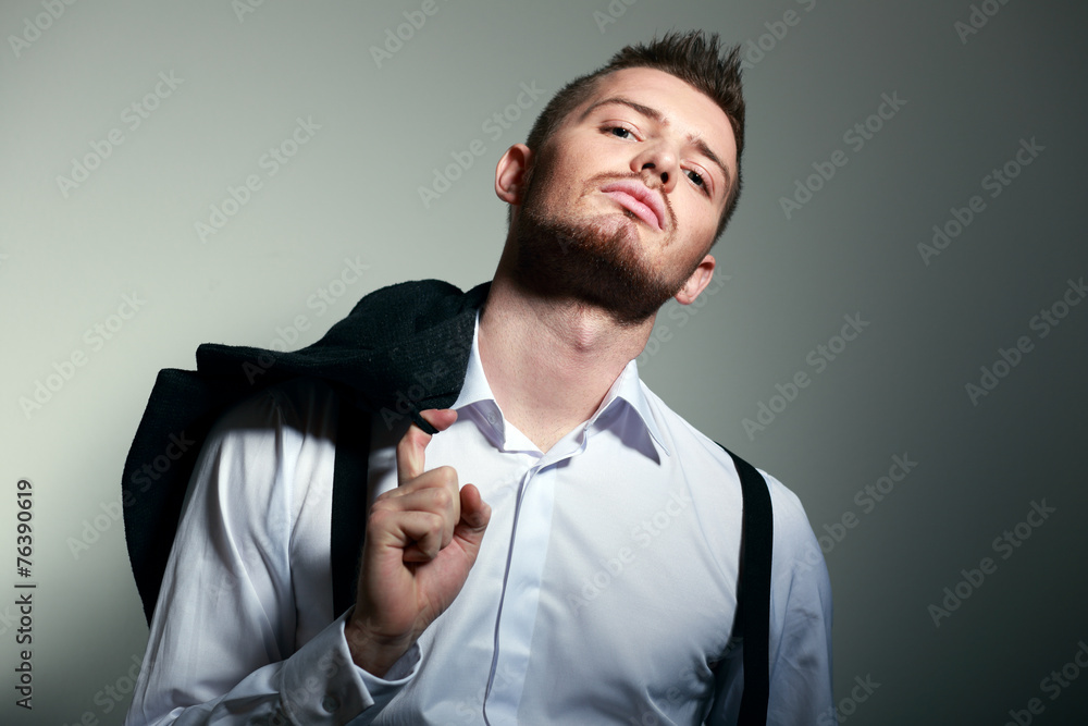 Wall mural young man hold coat