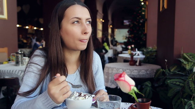 Woman Eating Chokolate in Cafe