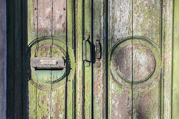 Old green door peeling