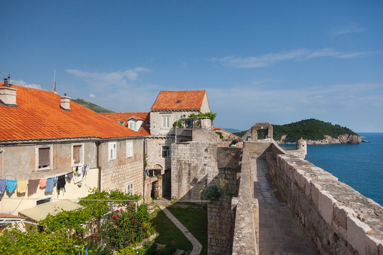 Old houses inside the city walls with Lokrum island 