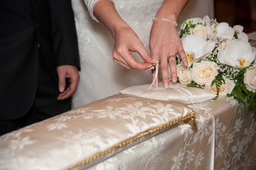 Obraz na płótnie Canvas Bride takes wedding ring