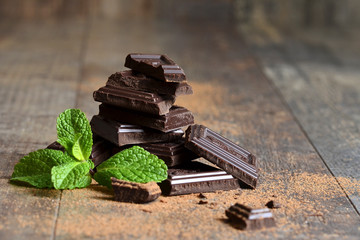 Stack of chocolate slices with mint leaf.