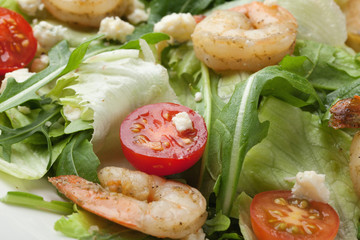 Fresh gourmet seafood salad with shrimps, greens, cherry tomatoe