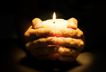 Hands with candle