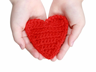 Obraz premium red crocheted heart in hands
