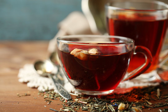 Beautiful vintage composition with herbal tea, on wooden table