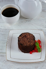 Yummy chocolate cupcake on table