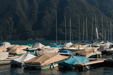 boats moored on lake Lugano in Switzerland