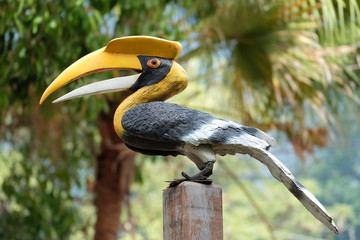 artificial hornbill on post © singburi