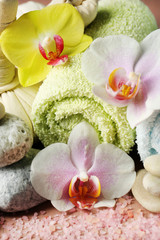 Naklejka na ściany i meble Spa treatments with orchid flowers and towels, close-up