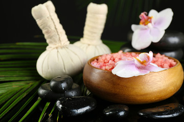 Beautiful spa composition with flowers on dark background