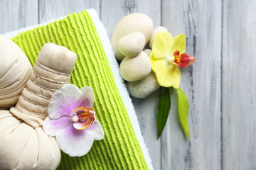 Spa treatments with orchid flowers on wooden table background