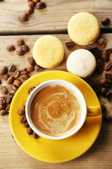 Gentle colorful macaroons and  coffee in mug