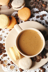 Gentle colorful macaroons and  coffee in mug