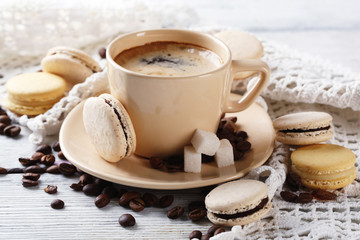 Gentle colorful macaroons and  coffee in mug