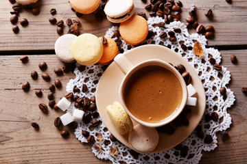Gentle colorful macaroons and  coffee in mug