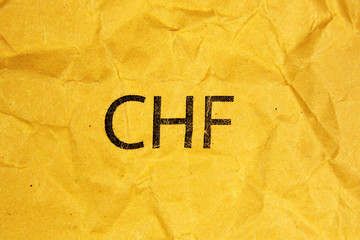 symbol of swiss franc CHF on paper