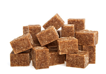 Brown sugar cubes on a white background