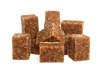 Brown sugar cubes on a white background