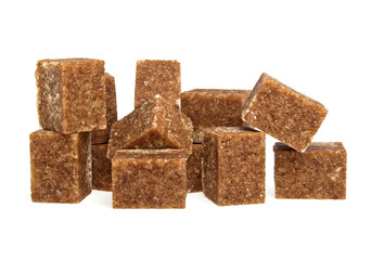 Brown sugar cubes on a white background