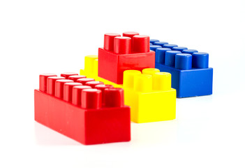Colorful plastic toy blocks close-yp