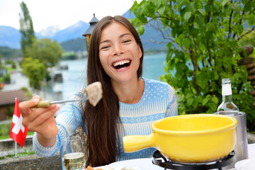 Swiss cheese fondue - woman eating laughing