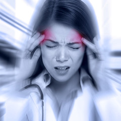 Young woman with a pounding headache