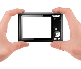 Hand holding a compact digital camera with empty LCD screen