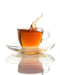 tea splash in a glass cup