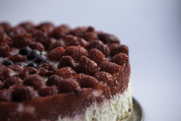Raspberry cheese cake on white background
